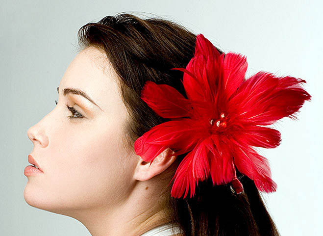 red feathers hair accessory fascinator on model large Smooth hairstyle with valentine`s day  touch 